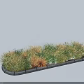Mixed Green and Golden Shrubs in Garden Bed With Stone Border Design
