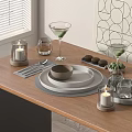 Elegant Tableware Set with Plates Bowls Glassware Candles and Green Garnish on Wooden Dining Table