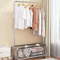 Modern Clothes Rack With Hanging Clothes And Bottom Basket In Indoor Setting