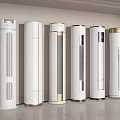 Several Modern White Tower Air Conditioner Fans with Gold Accents in Minimalist Interior