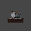 Vintage Weathered Blue Wooden Boat With Worn Paint On Gravel Platform