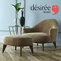 Beige Upholstered Leisure Chair With Ottoman Glass Side Table Vases Plant Blue Wall Wooden Floor