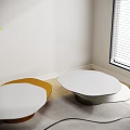 Contemporary Coffee Tables with Round White Orange Tops Metal Bases Wooden Floor Green Plant
