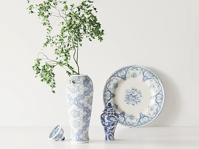 Elegant Blue and White Patterned Vase With Green Foliage Decorative Plate And Ornament 3d model