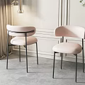 Modern Minimalist Dining Chairs With Light Pink Curved Upholstered Seats And Black Metal Frames