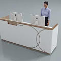 Modern White Reception Desk With Wooden Edge Two Computer Monitors And Staff Member