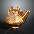Golden Teapot Shaped Sculpture with Intricate Patterns and Decorative Handles on Stable Base