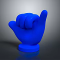 Man Holding Blue Rock Hand Gesture Sculpture With Blue Base