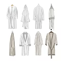 Different Styles of Neutral Colored Robes Hanging on Hangers Including Bathrobes and Long Cardigans