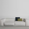 White Two Seater Sofa With Navy Blue And Green Cushions In Minimalist Design