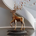 Golden Geometric Deer Sculpture With Butterfly Leaf Shaped Decorations Flying Upward Next To Spiral Staircase