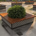 Square Tree Planter with Wooden Top and Green Shrub in Stone Paved Area