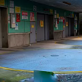 Indoor Parking Lot With Green Walls Gray Doors Yellow Ground Lines And Number 2 Signs