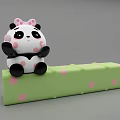 Cute Panda Doll With Pink Bow Sitting On Green Polka Dot Block