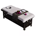 Comfortable Massage Bed With Brown Frame Soft Cushion Face Hole Towels And Flowers