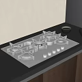 Modern Kitchen Gas Stove On Black Countertop With Wooden Cabinets