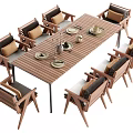 Wooden Outdoor Table with Cushioned Chairs Plates and Wine Glasses on Patio