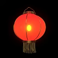 Traditional Red Hanging Lantern Illuminated With Yellow Light And Golden Tassels