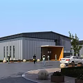 Modern Industrial Factory Building Exterior With Entrance Parking Lot And Greenery