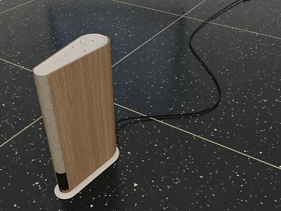 Modern Wooden Bluetooth Speaker With White Stand And Black Cable On Speckled Floor 3d model