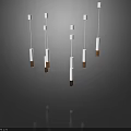 Modern White and Gold Cylindrical Pendant Lights Hanging in Minimalist Space