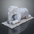 Artistic Stone Elephant Sculpture in Reclining Position on Textured Stone Base