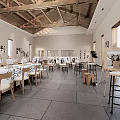 School Art Studio Interior With Wooden Ceiling Tables White Tablecloths Easels And Windows