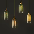 Stylish Colorful Glass Pendant Lights With Gold Accents Hanging On Dark Background