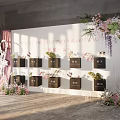 Commercial Display Equipment With Black Square Boxes And Floral Decorations On White Wall