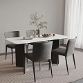 Modern Dining Table Set With White Tabletop Grey Chairs Green Plant And Fruit Bowl