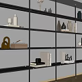 Modern Black Frame Shelving Unit With Multiple Tiers Displaying Vases Books Sculptures On White Wall