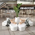 Swarovski Mall Store Modern Interior With White Pink Seating And Green Plant Decor
