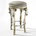 Vintage Silver Stool With Intricate Carved Legs And Padded Seat Design