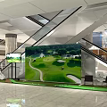 Shopping Mall Lobby with Escalators Large Golf Scene Screen and Green Grass Area