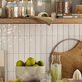 Stylish Kitchen Utensils With Wooden Cutting Board Limes Glass Jars And White Tiled Background
