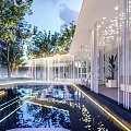 Modern Residential Landscape With Reflective Pool Pathway Lighting And Lush Trees