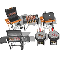Various Barbecue Grills Including Skewers And Meat For Outdoor Cooking