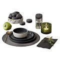 Black Dinnerware Combination With Plates Bowl Woven Placemat Gold Cutlery And Green Accents