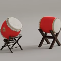 Traditional Red Musical Drums with White Drumheads on Wooden Stands for