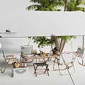 Outdoor Table Setup with White Umbrella Palms Hanging Chairs Colorful Balloons and Fruit Tableware