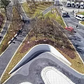 Urban Plaza Landscape With Winding Pathways Green Lawns Trees And Pedestrians