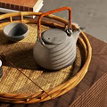 Traditional Tea Set With Gray Striped Teapot And Small Bowl On Wicker Tray Wooden Tabletop