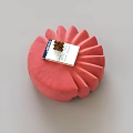 Red Stool with Petal Shaped Design Topped With Small Book And Pine Cone 3d model