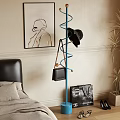 Blue Spiral Coat Rack With Black Hat Handbag In Bedroom With Plant And Wall Art