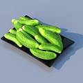 Organic Fresh Green Cucumbers Arranged on Black Plate Against Gray Background