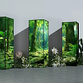Floral Installation Featuring Three Forest Themed Display Pillars and Surrounding Flowers Green Plants