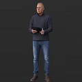 Man Standing in Dark Long Sleeve Shirt and Blue Jeans Holding Black Tablet with Pen
