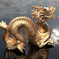 Golden Dragon Sculpture Carving With Intricate Details And Artistic Design