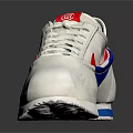 White Sneakers With Red And Blue Accents On Tongue Laces And Soles