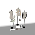 Fashion Mannequins On Display Stands With Handbags Shoes And Green Plant In White Background
